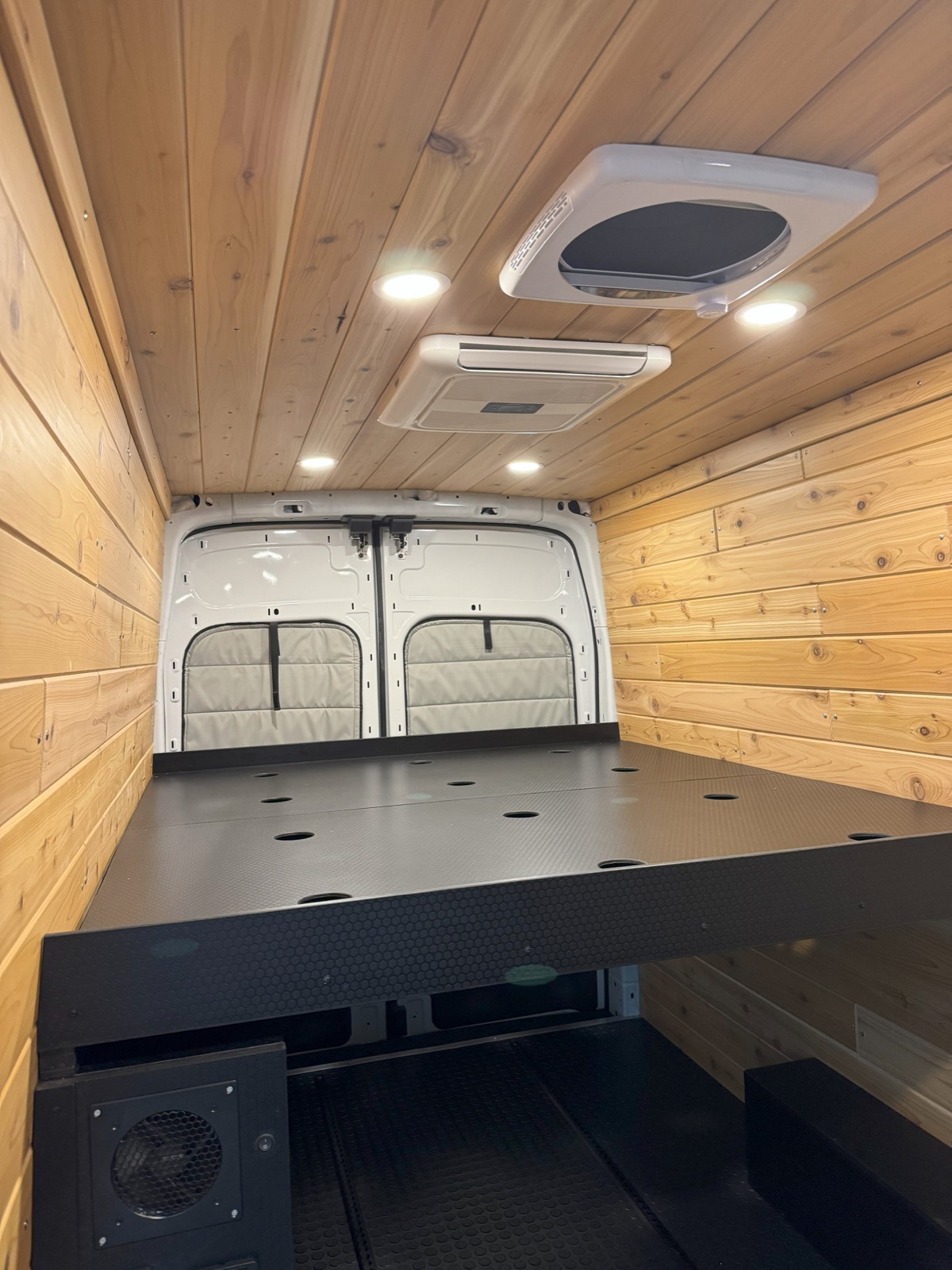 Cedar Minimal Build — cedar-lined van interior with bed