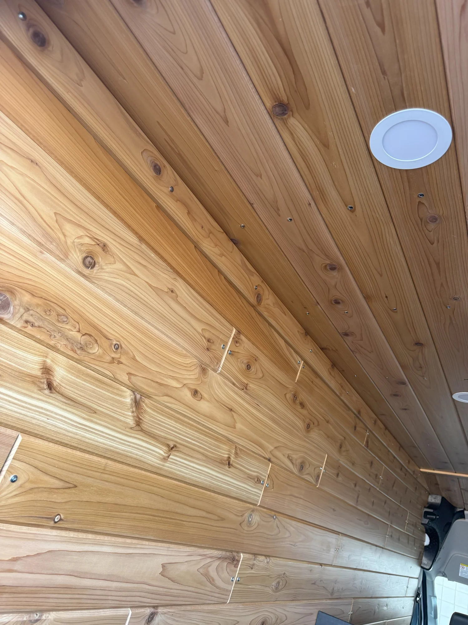 Roof ventilation, cooling, and lighting share a carefully planned ceiling.
