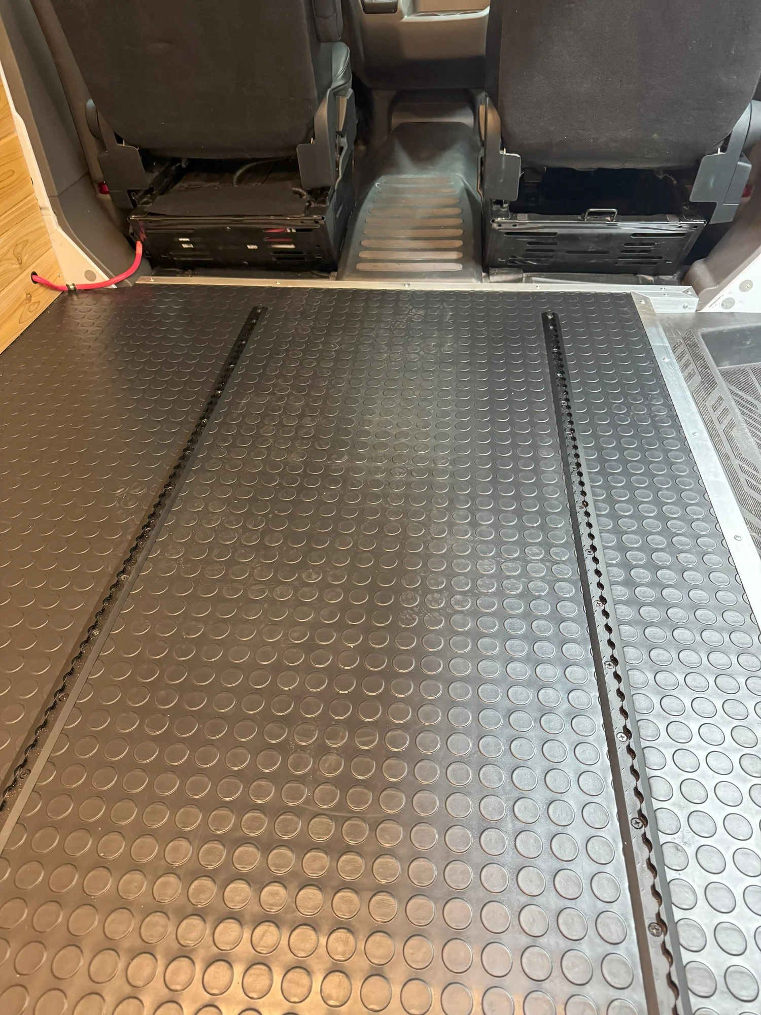 Coin flooring and aluminum edges protect the high-wear surfaces.