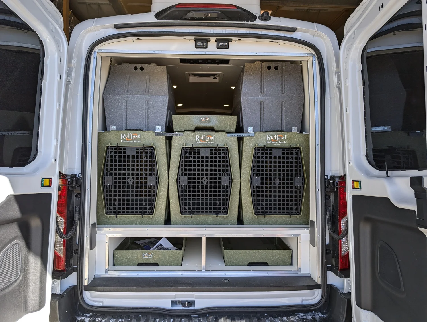 Dog Show Transport's secured kennel wall and open washable cargo aisle