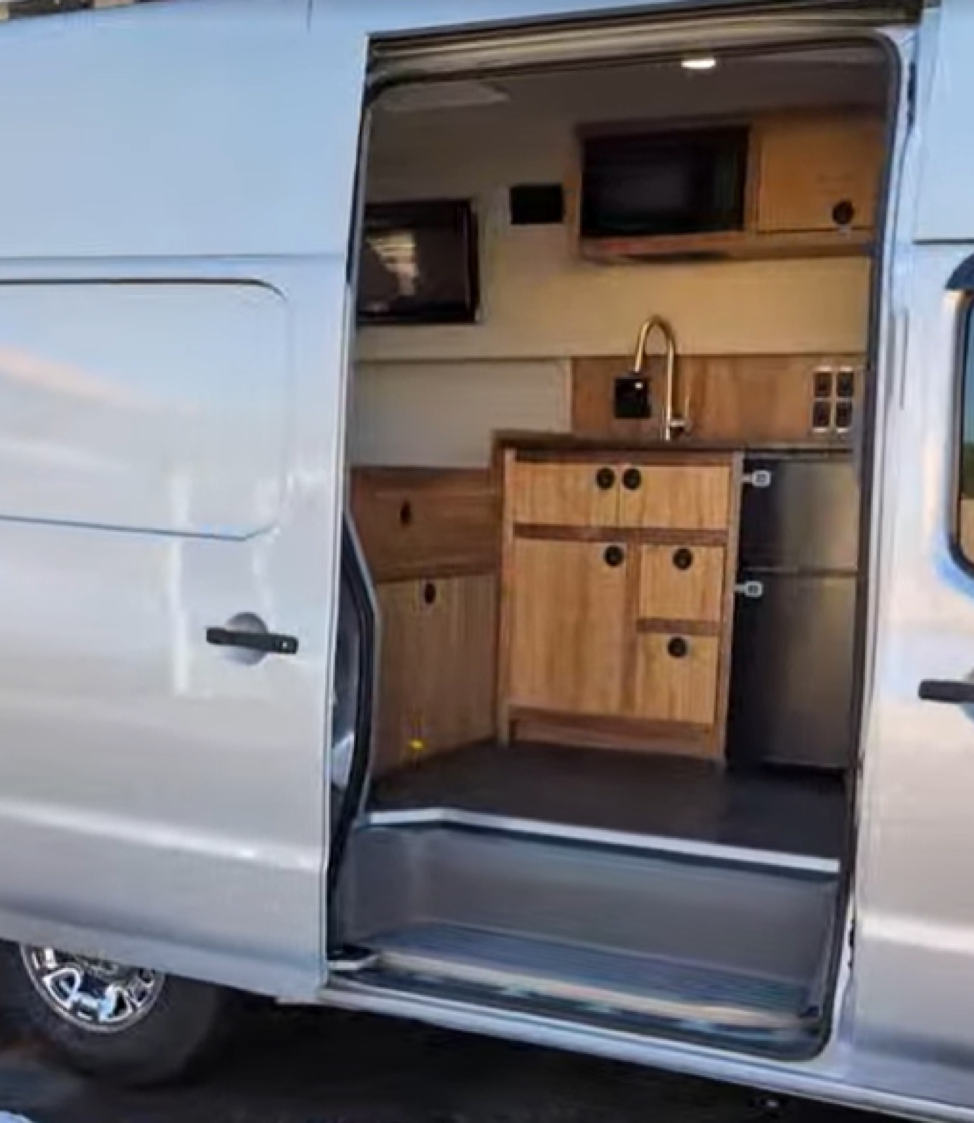 Nissan Build-Out — compact van conversion with open slide door