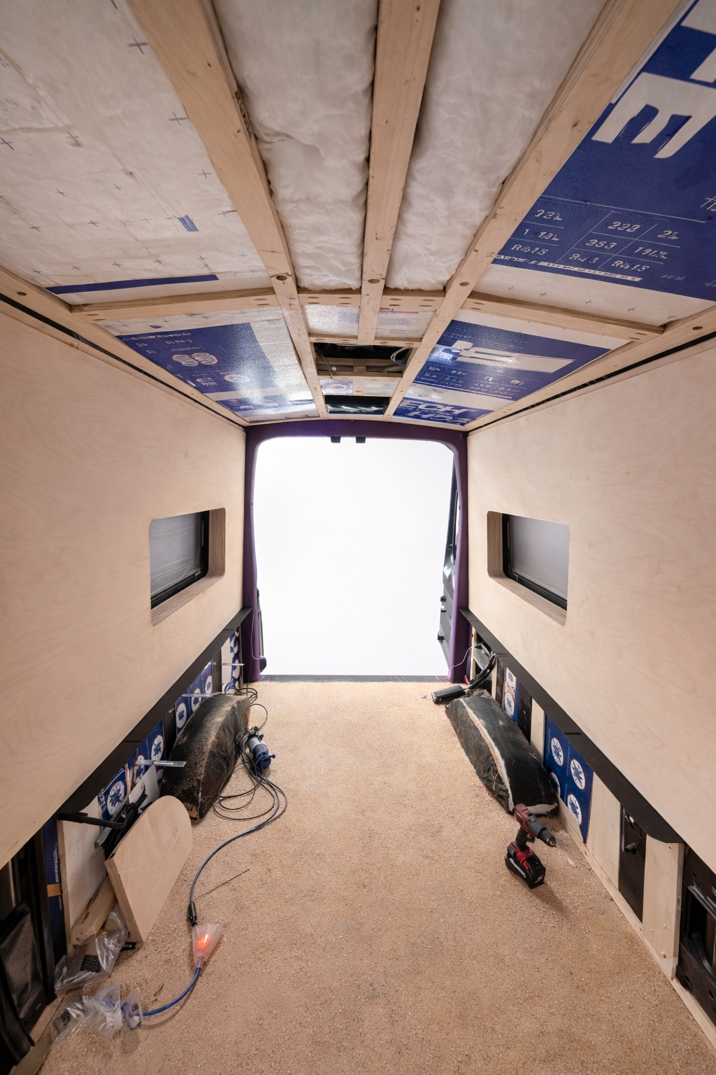 Frida during construction with insulated ceiling and unfinished birch wall panels