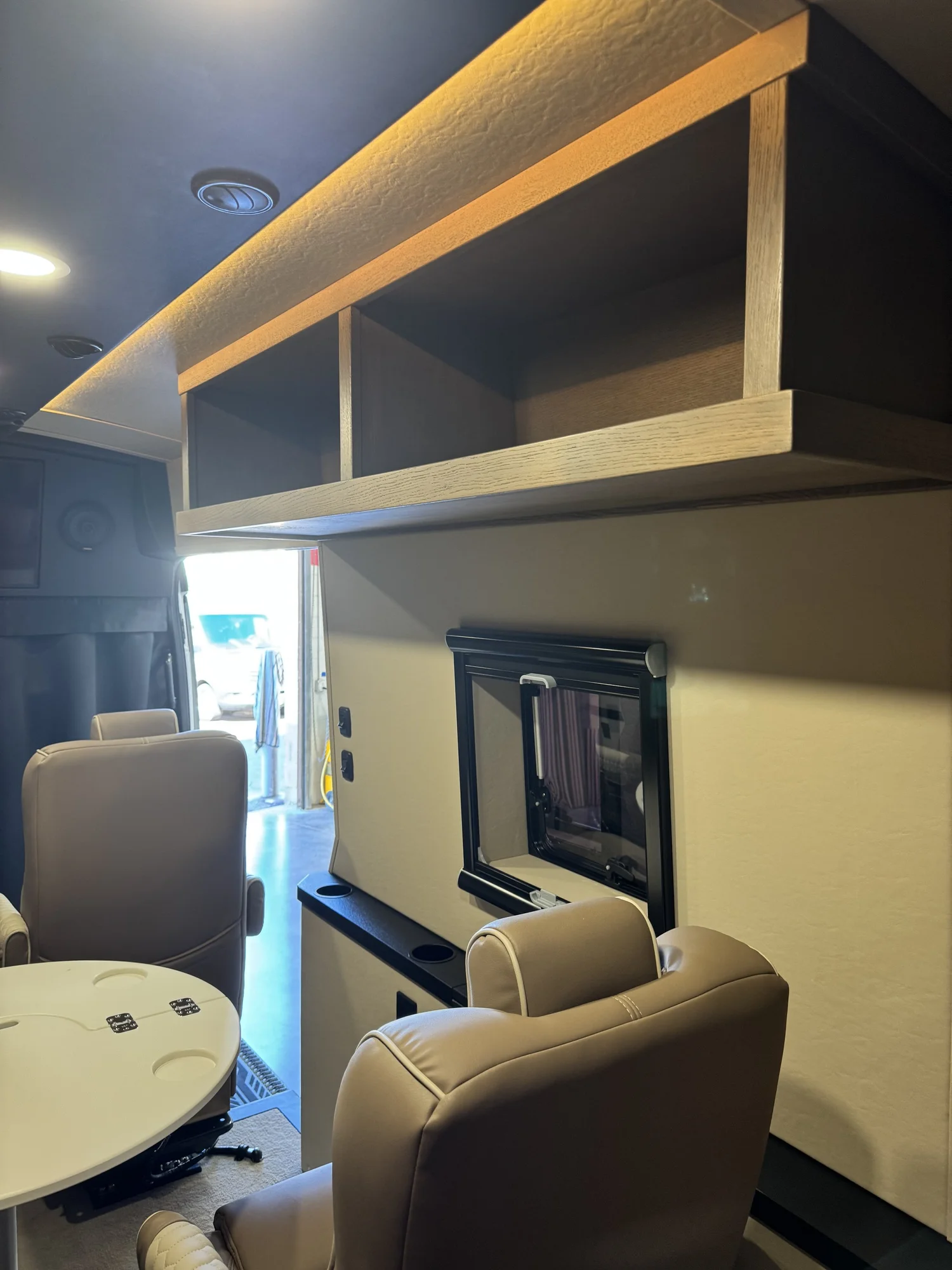 A compact galley supports drinks, meals, and longer touring days.