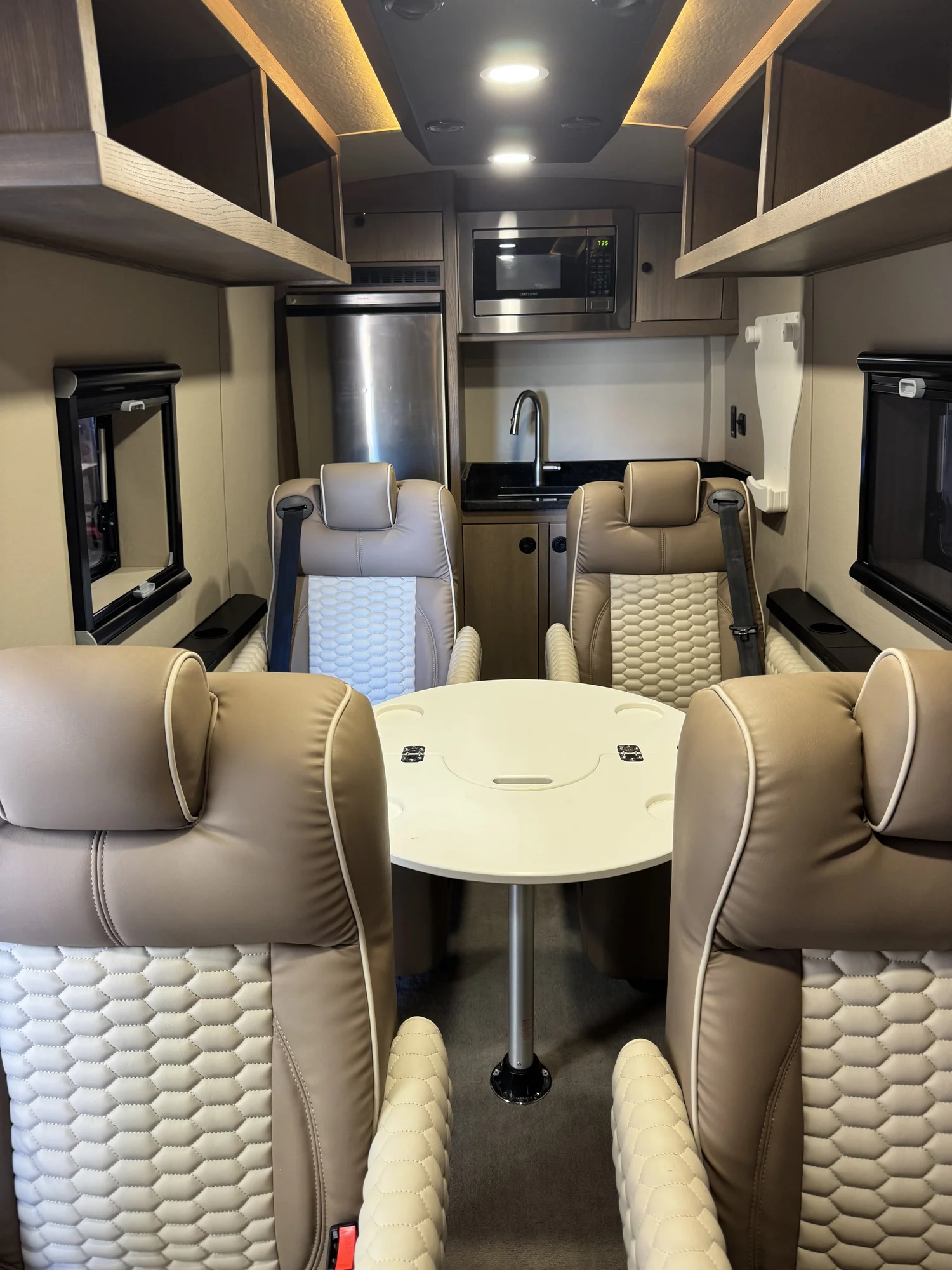 Luxury shuttle systems and concealed service integration beneath finished cabinetry