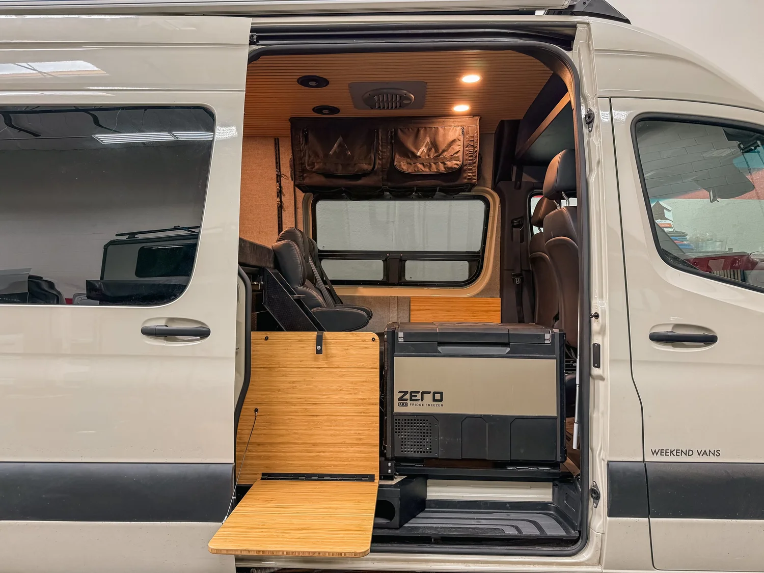 The rear bed leaves a usable garage zone beneath it.