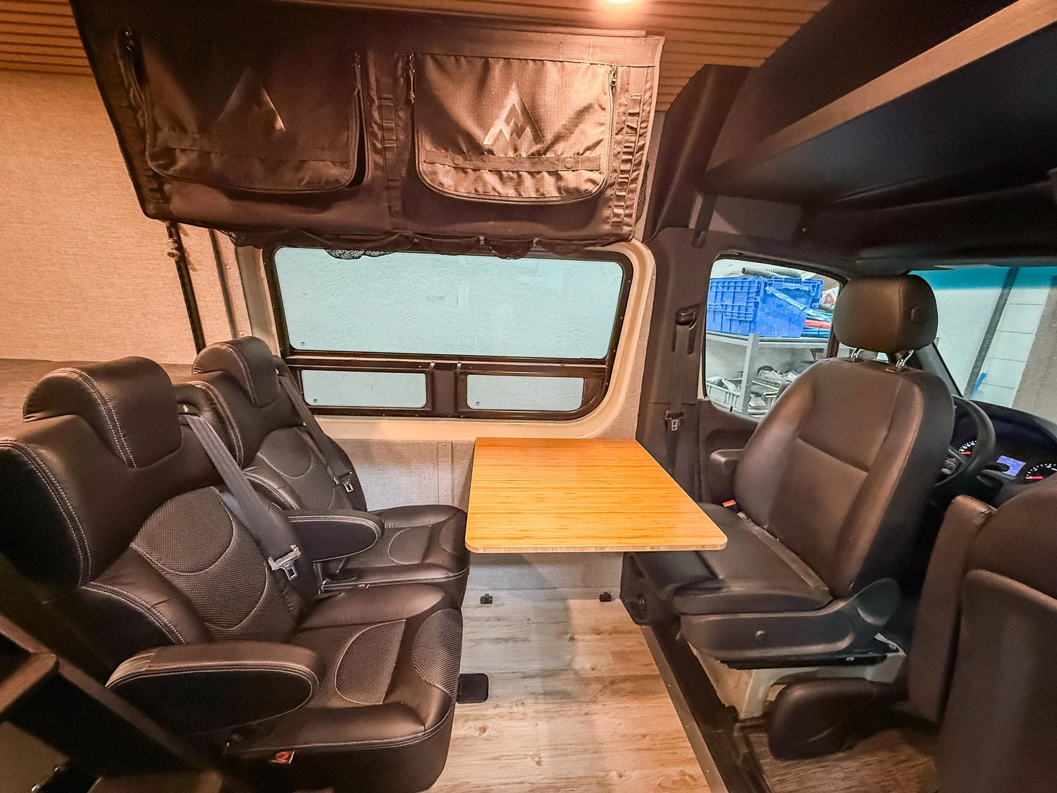 Rebuilt Sprinter service area with organized electrical and plumbing access