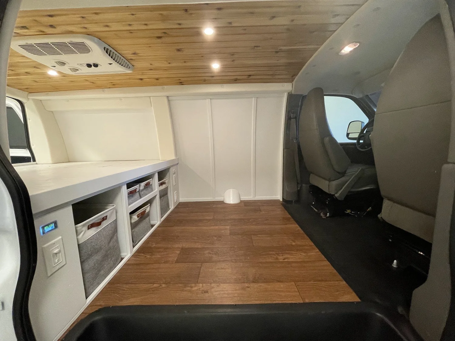 The wood ceiling brings warmth to a restrained palette.