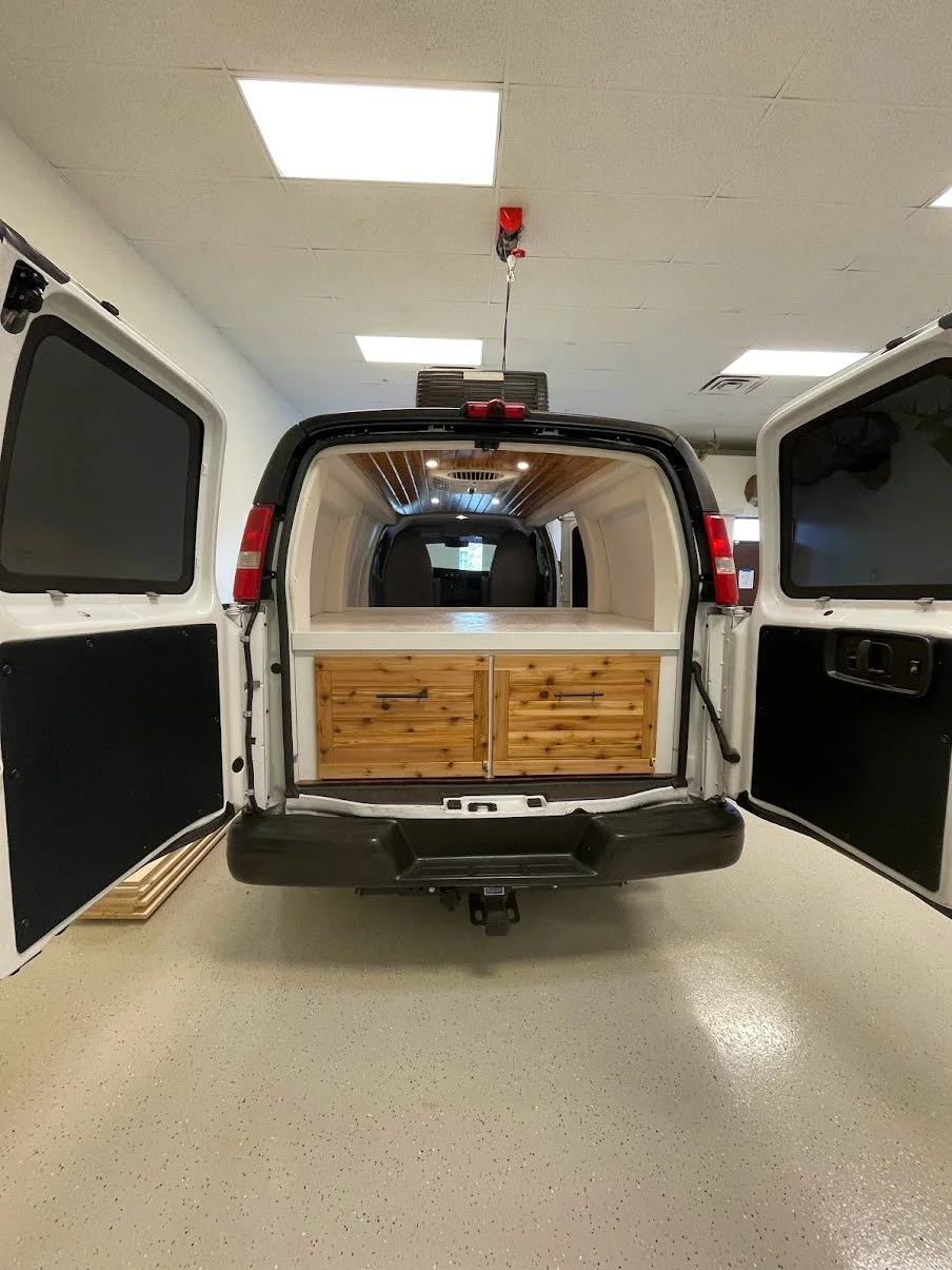 The Minimalist interior showing its compact climate, lighting, and storage layout