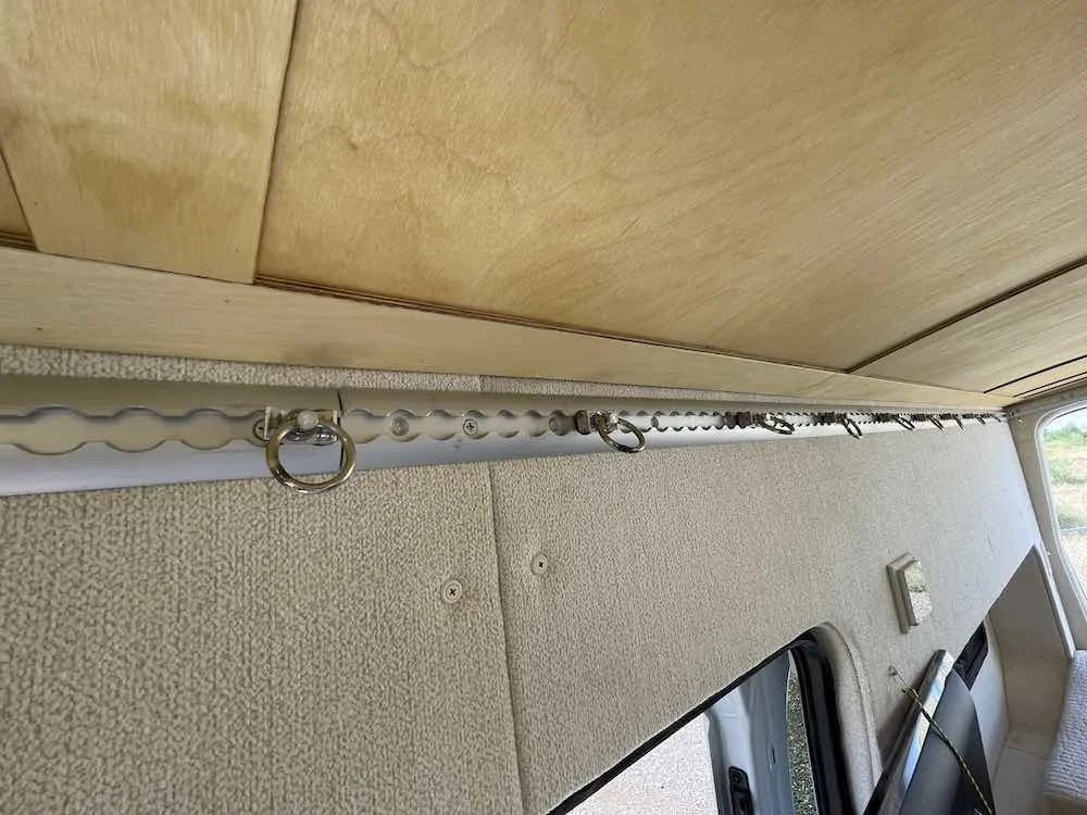 Integrated tie-downs and storage keep travel gear under control.