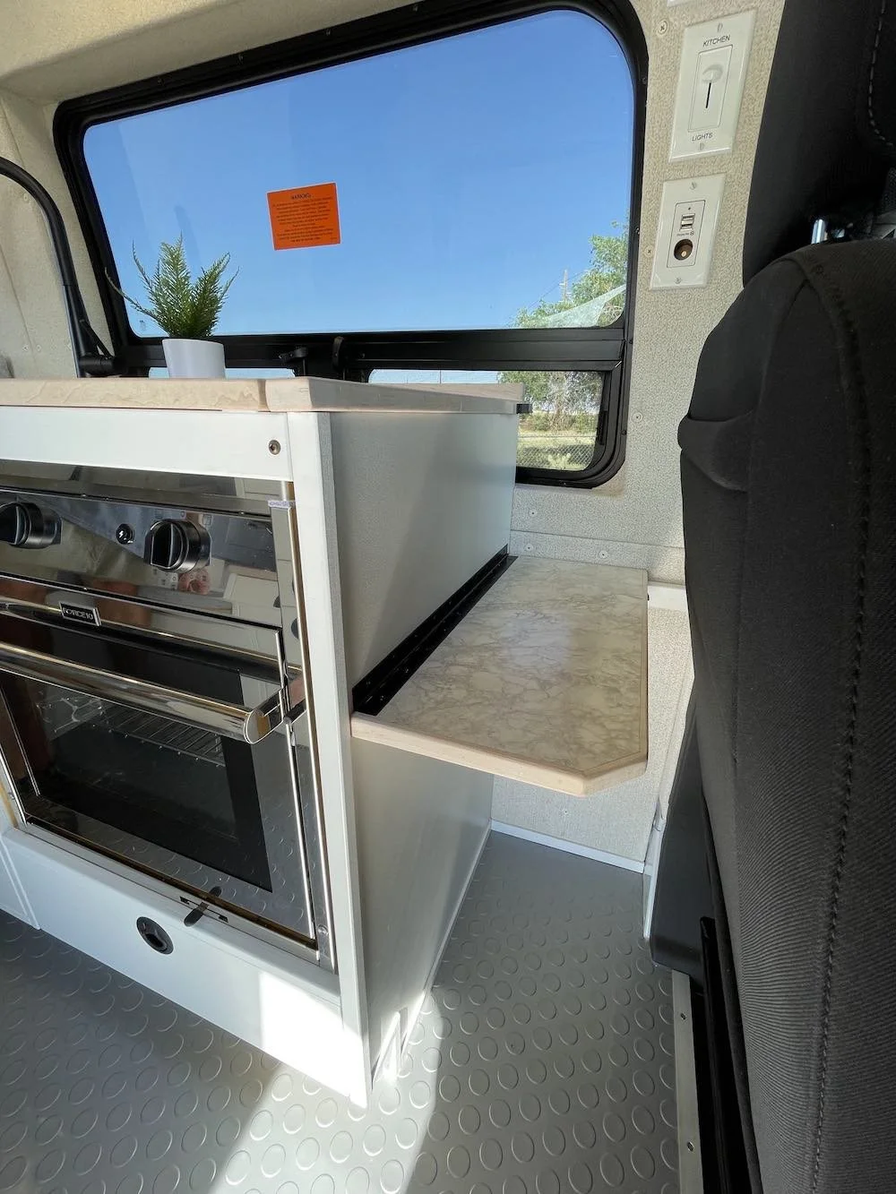 The galley brings the sink, storage, and cooking functions into one run.