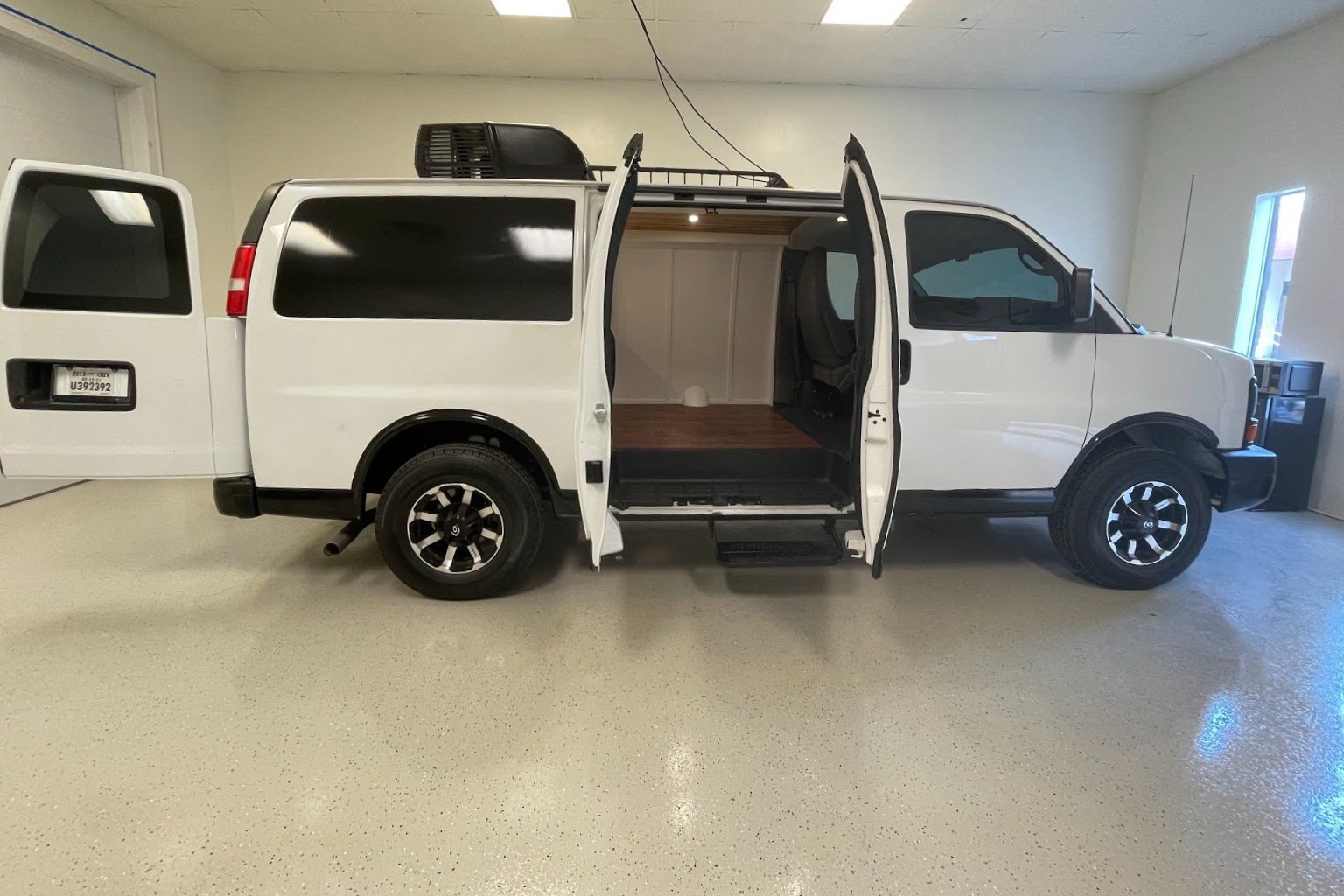 Van with doors open in the New Life Conversions shop