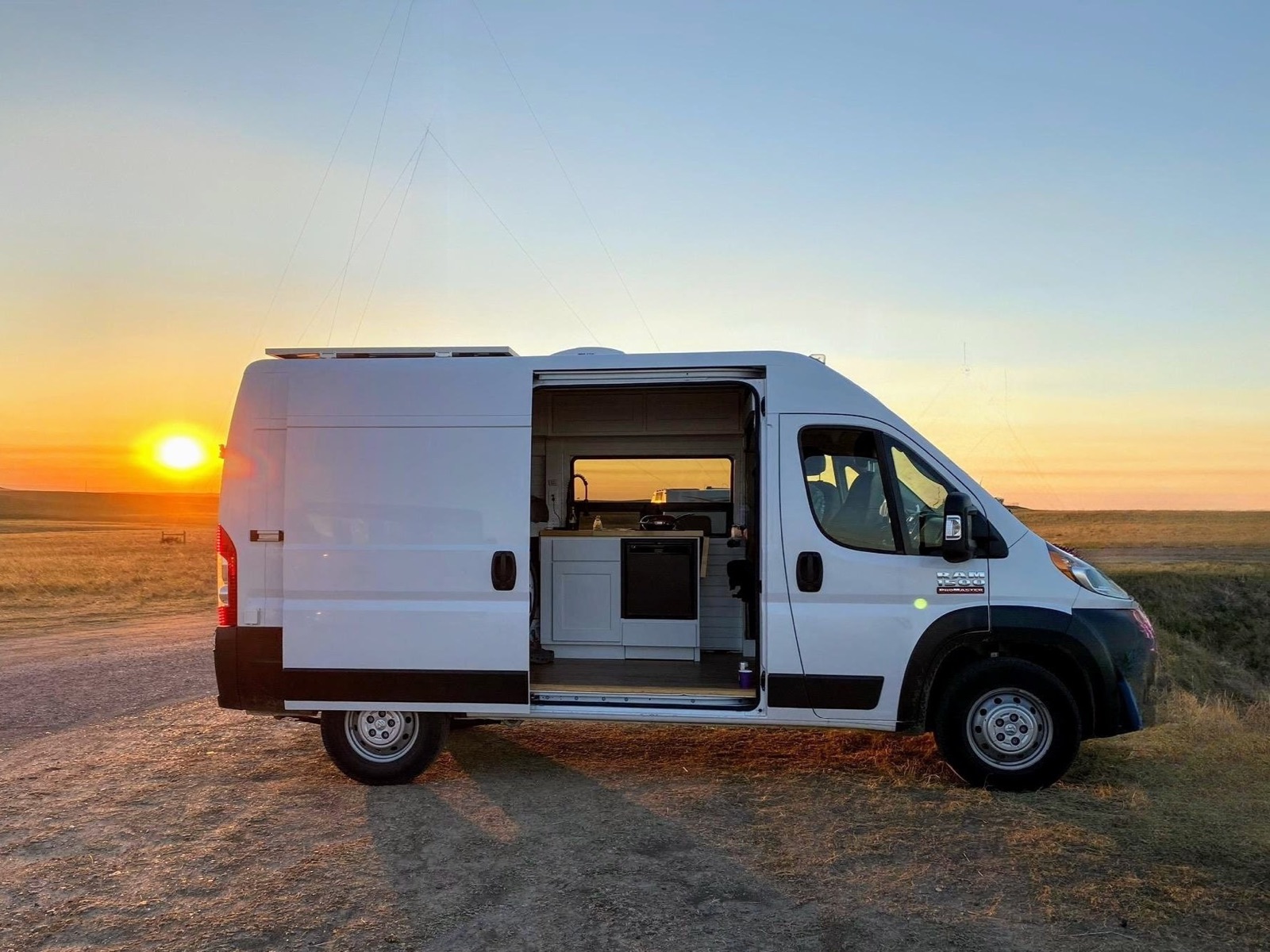 Camper van parked at sunset in the Arizona desert